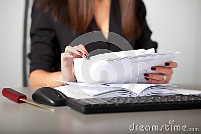 Young woman secretary sort by size letters Stock Photo