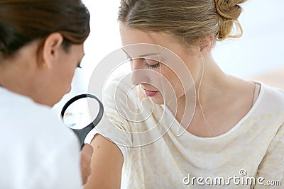 Young woman seeing dermathologist Stock Photo