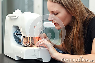 Young woman sewing Stock Photo