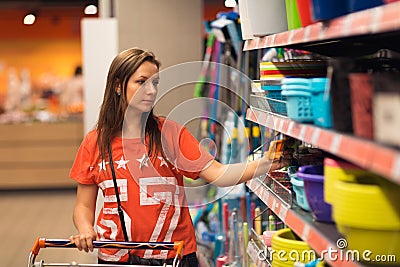 Young woman shopping for cereal, bulk in a grocery supermarket Stock Photo