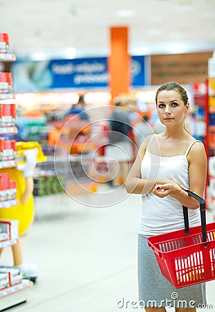 Young woman shopping for cereal, bulk in a grocery supermarket Stock Photo