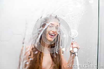Young woman showering Stock Photo