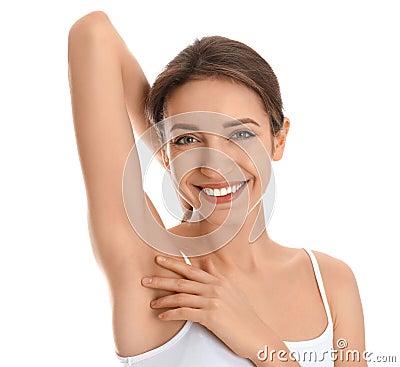 Young woman showing armpit with smooth clean skin on white background Stock Photo