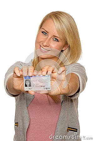 Young woman showing her driver's license Stock Photo