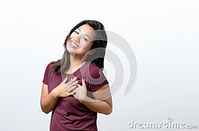 Young woman showing her heartfelt gratitude Stock Photo