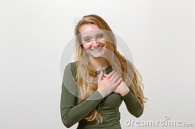 Young woman showing her heartfelt gratitude Stock Photo