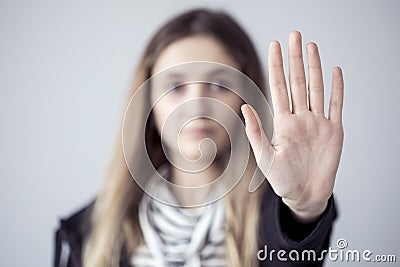 Young woman showing stop gesture open palm hand Stock Photo