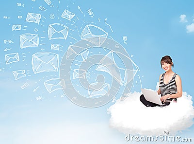Young woman sitting in cloud with laptop Stock Photo