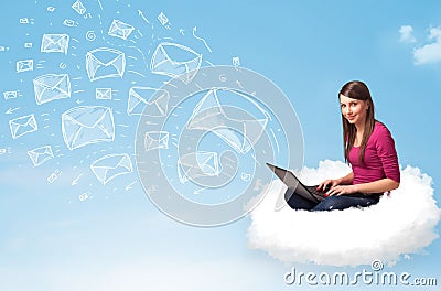 Young woman sitting in cloud with laptop Stock Photo