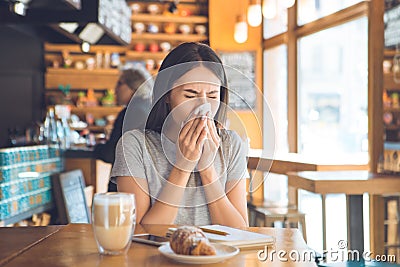 Young woman sitting in a coffee shop leisure Stock Photo