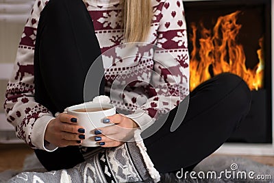 Winter Warmth: Cozy Evening by the Fireplace Stock Photo