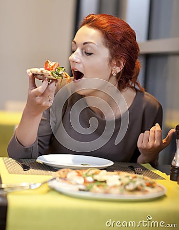 A young woman sitting in a restaurant, smilin Stock Photo