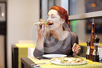 A young woman sitting in a restaurant, smilin Stock Photo