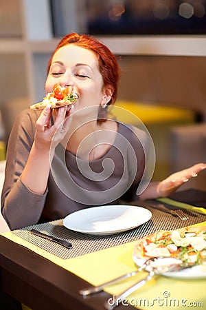 A young woman sitting in a restaurant, smilin Stock Photo