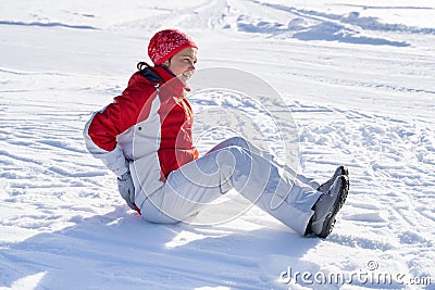 Young Woman Slips And Falls Down On Snowy Road Stock Photo