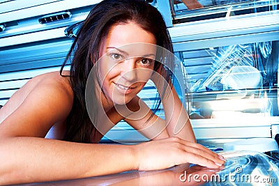 Young woman in solarium Stock Photo