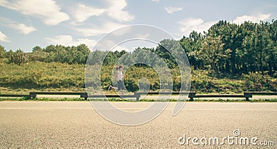 Young woman in sportswear running on a runway Stock Photo