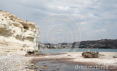Young woman standing at the edge of a cliff enjoying the sea scenery. Pissouri coastline Limassol Cyprus Stock Photo