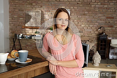 Young woman in cosy home Stock Photo