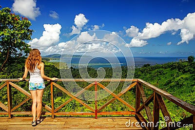 Young woman standing at the viewpoint in Bouma National Heritage Stock Photo