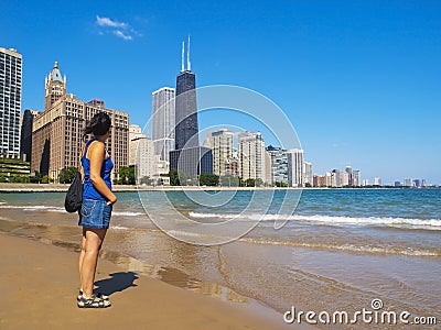 Young woman staring at the Chicago Skyline Stock Photo