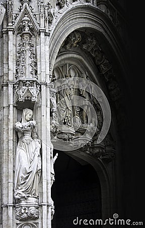 Young woman statue of gothic facade Stock Photo
