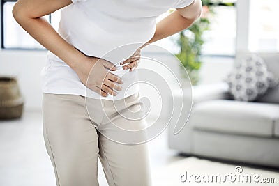 Young woman with stomach pain Stock Photo