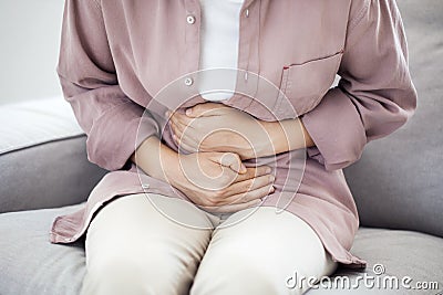 Young woman with stomach pain Stock Photo