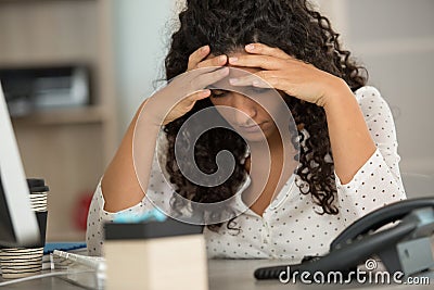 young woman stressed at work Stock Photo