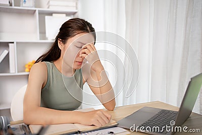 Young woman stressed or worried about doing a wrong job Stock Photo