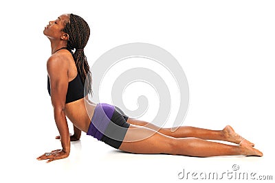 Young Woman Stretching on Floor Stock Photo