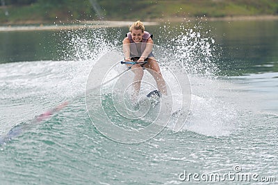 Young woman study riding wakeboarding on lake Stock Photo