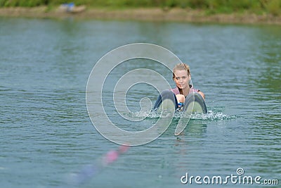 Young woman study riding wakeboarding on lake Stock Photo