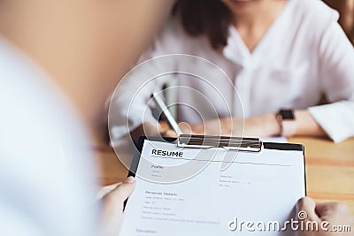 Young woman submit resume employer to review job application. Stock Photo