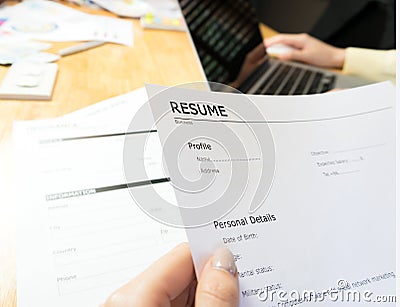 Young woman submit resume to employer to review job application. Stock Photo