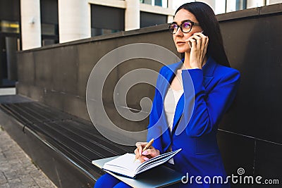 Young woman successful lawyer talking via cell telephone Stock Photo