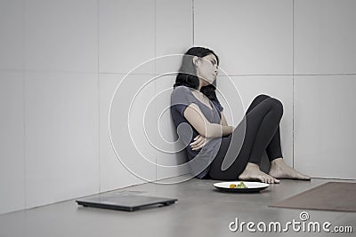 Young woman suffering anorexia at bathroom Stock Photo