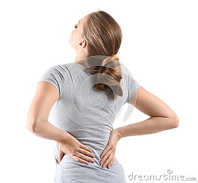 Young woman suffering from back pain on white background Stock Photo