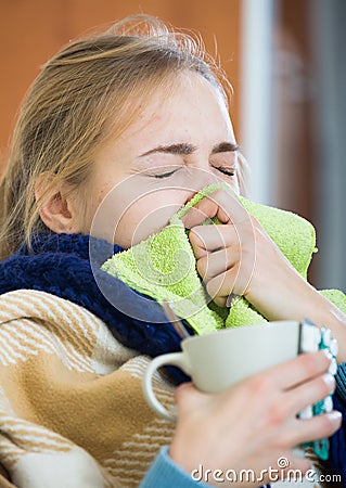 Young woman suffering of cold and having stuffy nose Stock Photo