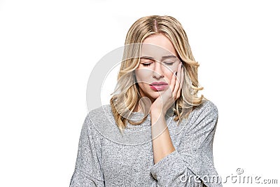 Young Woman Suffering From Toothache. Tooth Pain And Dentistry background. Beautiful Young Woman Suffering From Teeth Pain. Stock Photo