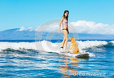 Young Woman Surfing with Her Dog Stock Photo