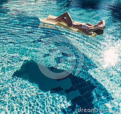 Young woman in swimming pool Stock Photo