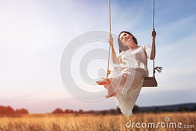 Young woman on a swing Stock Photo