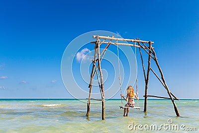 Young woman on swing Phu Quoc Stock Photo
