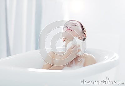 Young woman take a bath in bathtub Stock Photo