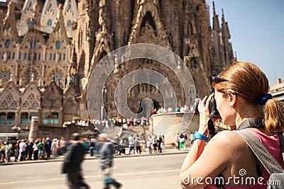 Young woman taking picture of Sagrada Familia, Barcelona, Spain Editorial Stock Photo