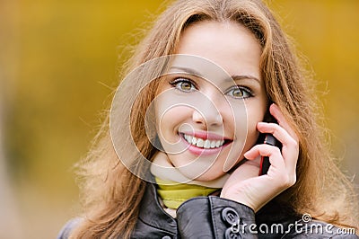 Young woman talks on cellular Stock Photo