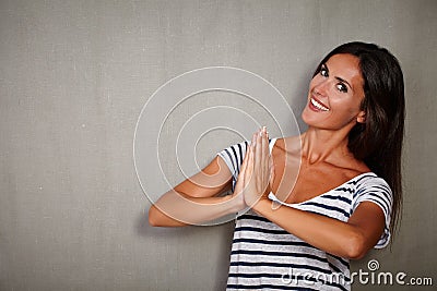 Young woman thanking while looking at camera Stock Photo