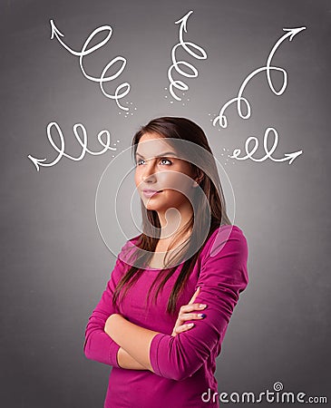 Young woman thinking with arrows overhead Stock Photo