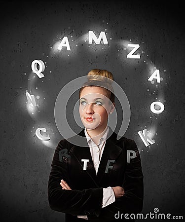Young woman thinking with letter circulation around her head Stock Photo